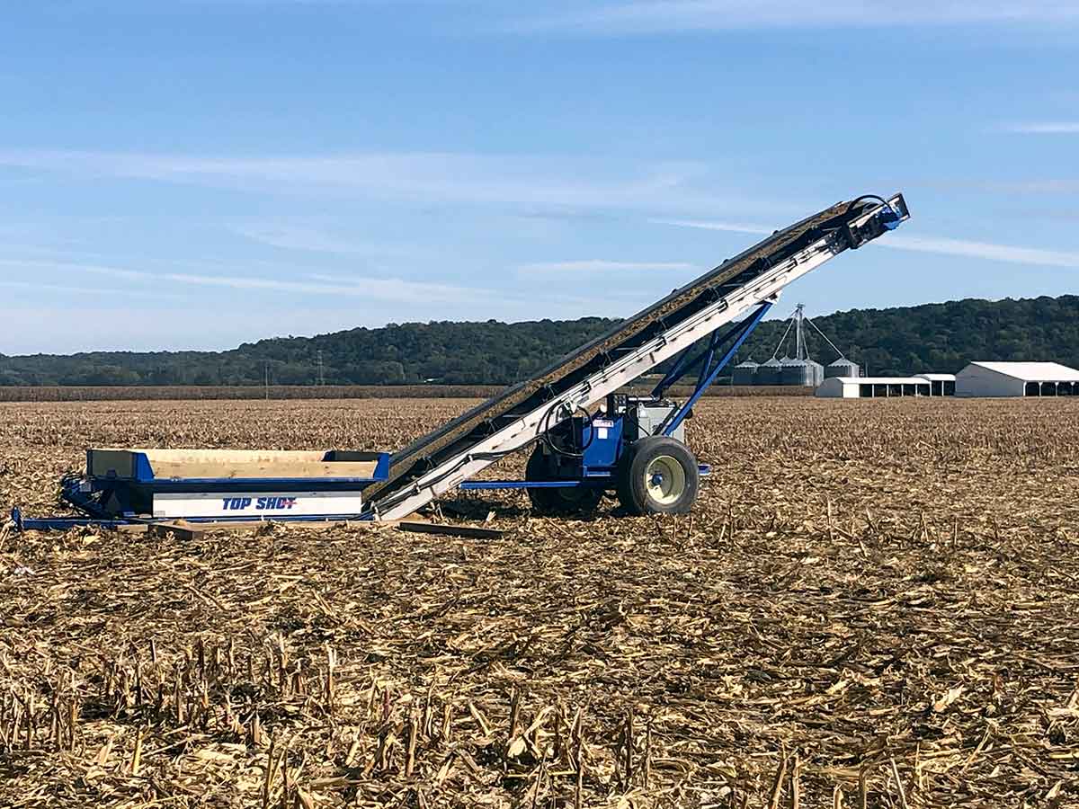Top Shot Lime Loader aggregate conveyor in field