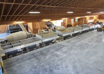 Dual 13-ton Rotary Blender AUTOBATCH blend system loading two dry fertilizer tender trucks at the same time